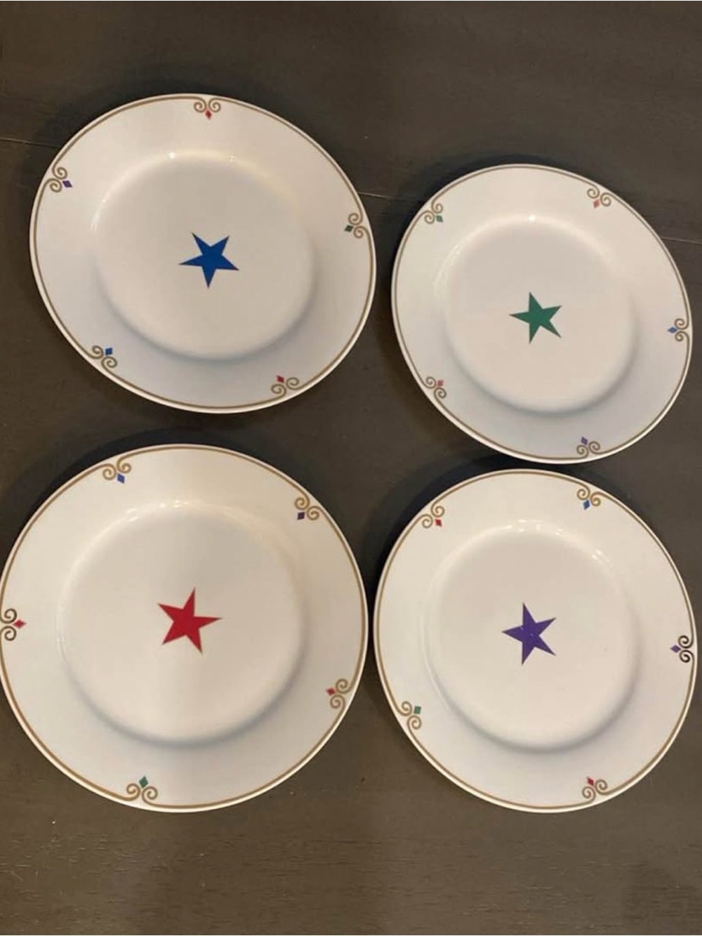 Pier 1 White  Plates with Multicolor Star Accents and Gold Trim